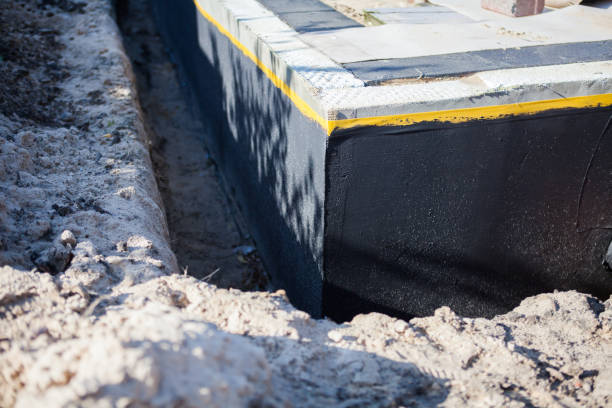 Professional Basement Waterproofing technician working in Grant, MN